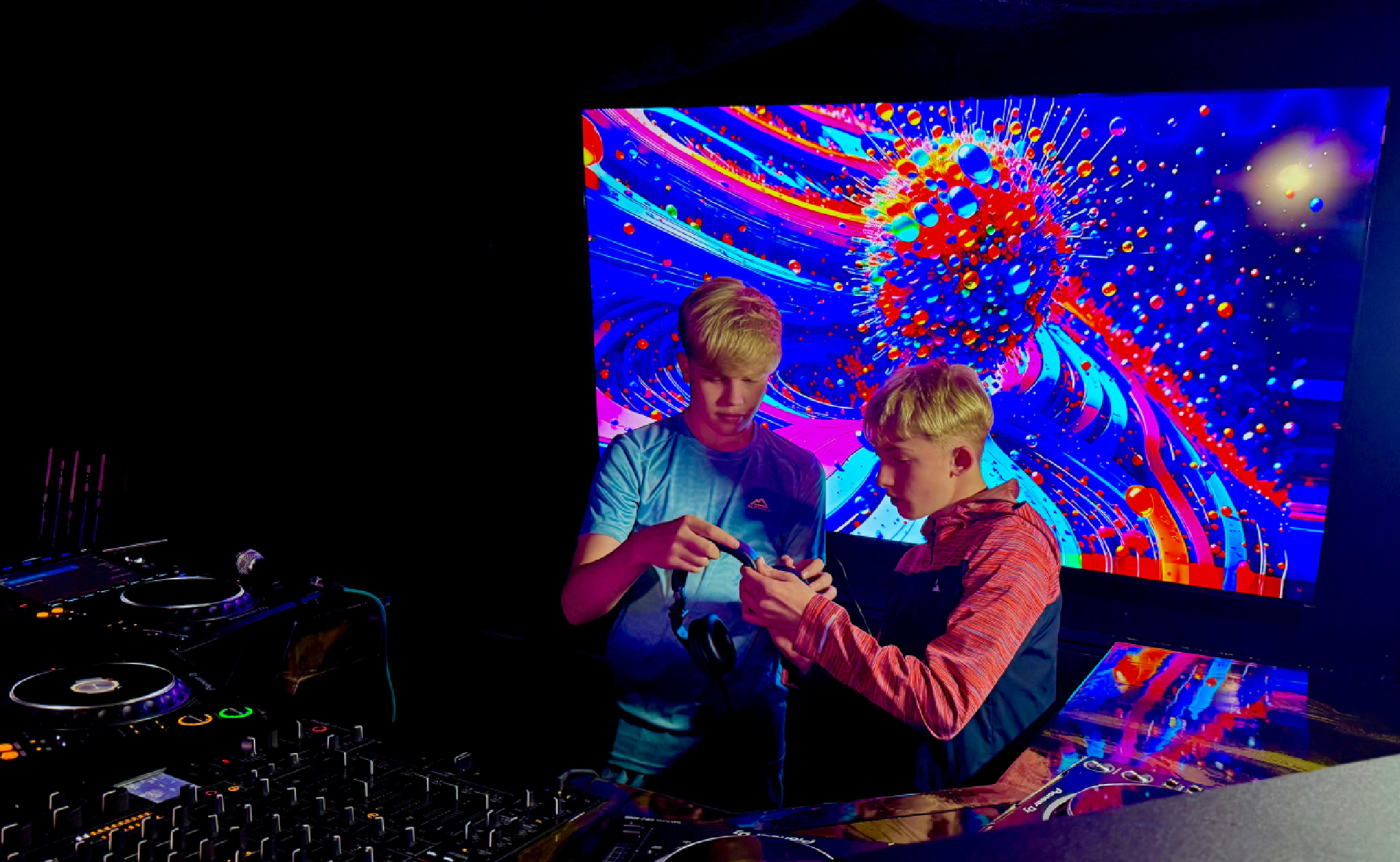 Two young boys in a DJ studio